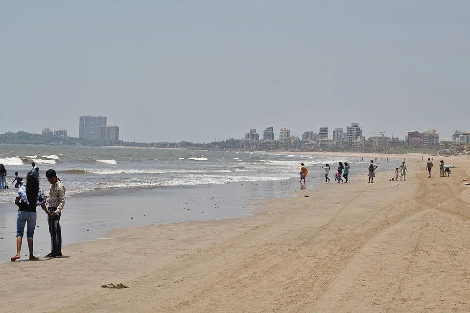 Juhu Beach at low tide with the hotels along Juhu Tara Road behind the sand